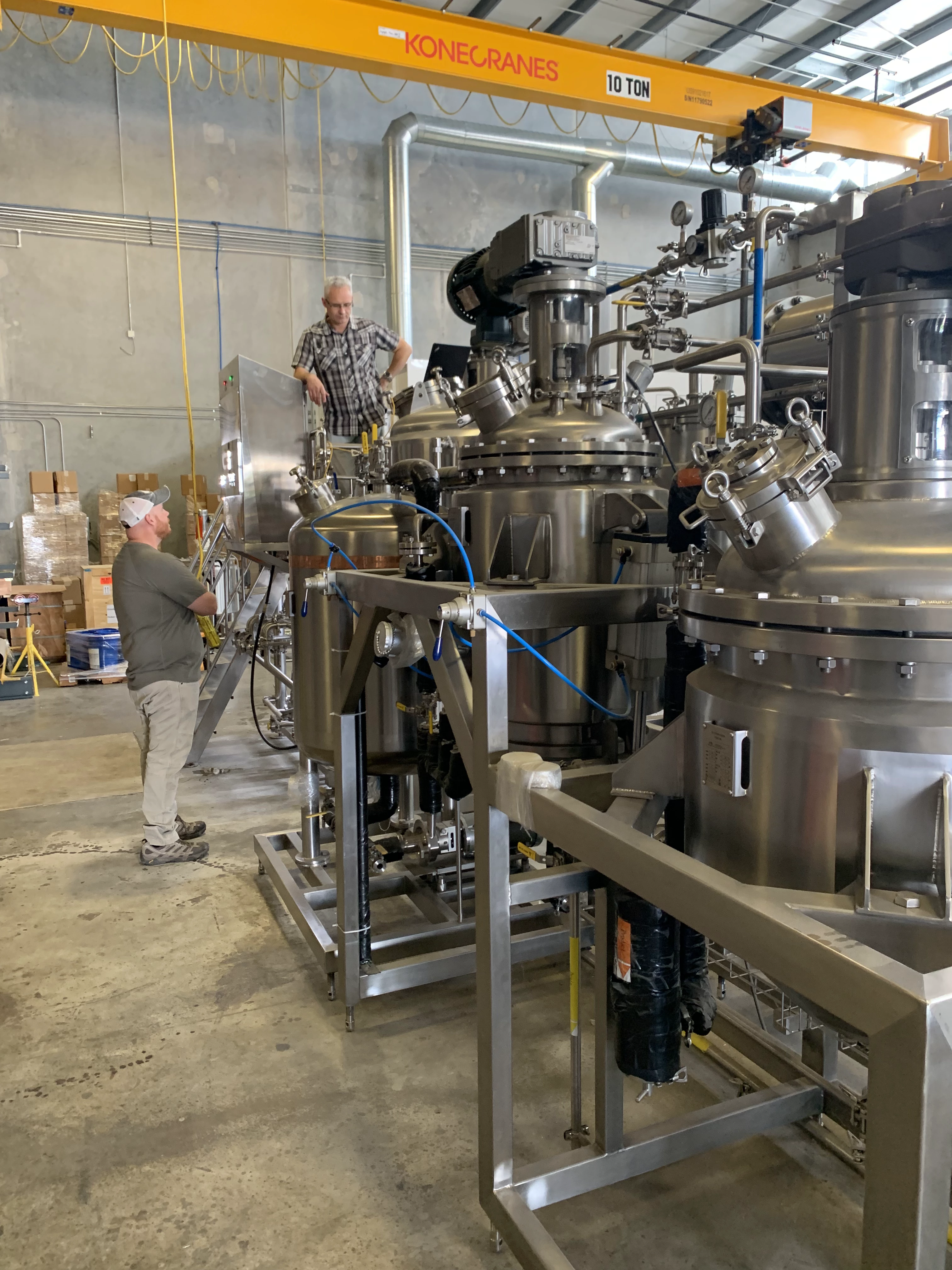 Stainless process vessels being assembled in a production facility